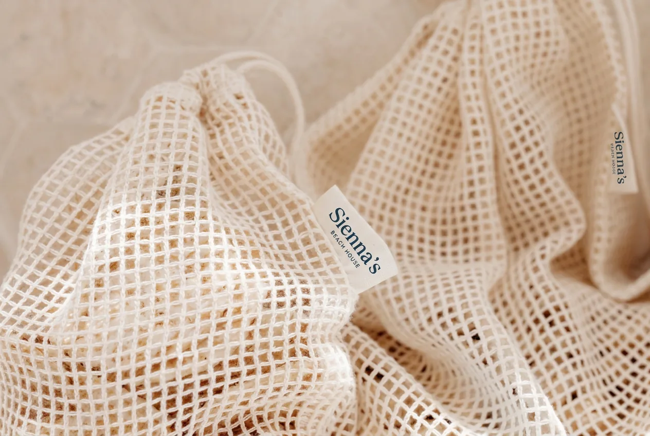 The full-name Sienna's woven label sewn onto a mesh beach bag