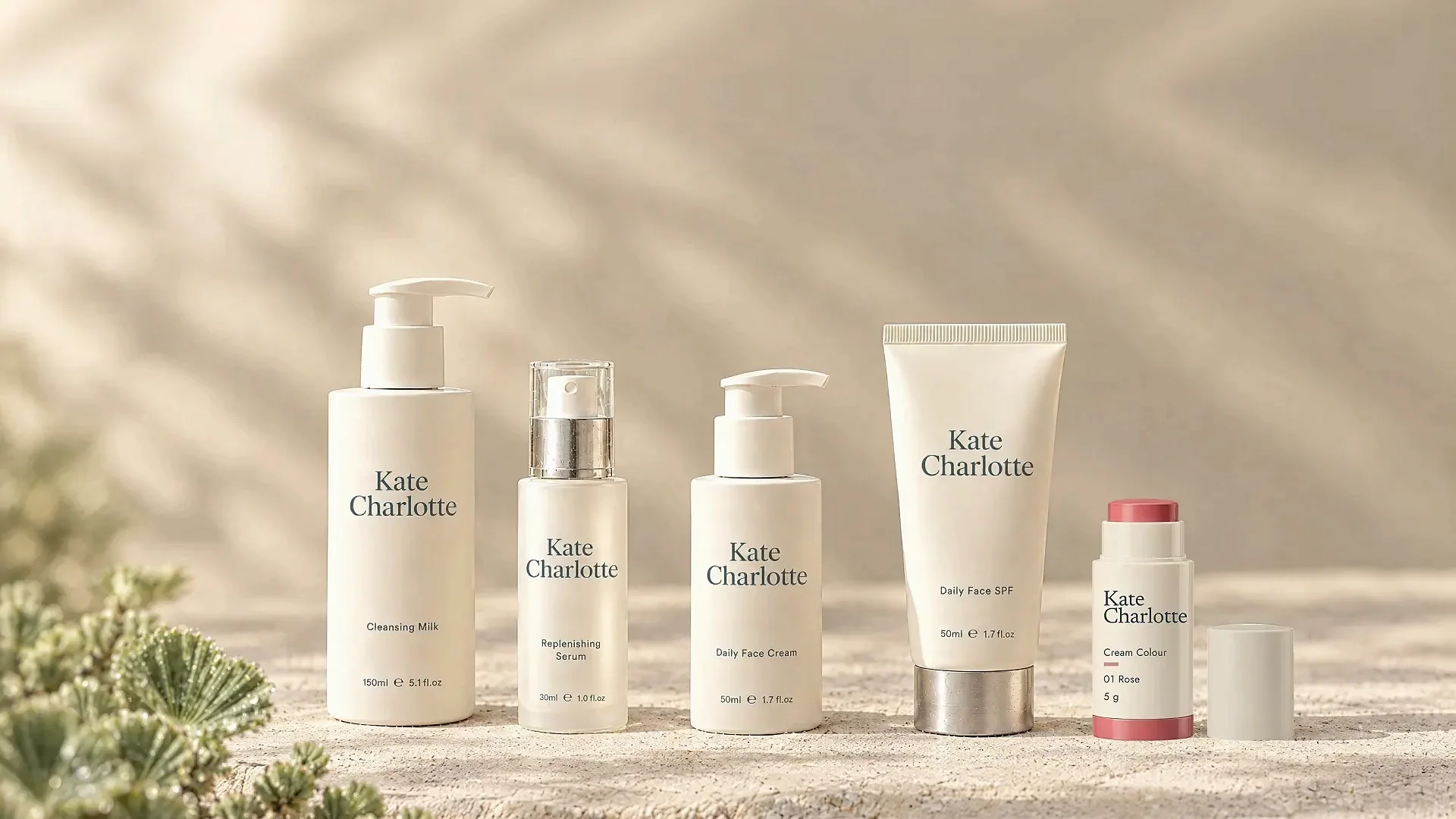 The five Kate Charlotte products on limestone; the camera turns down and left to the revived resurrection plant beside them